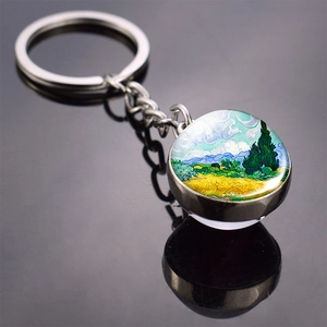 Detailed macro view of silver Van Gogh Wheatfield with Cypresses glass ball keychain