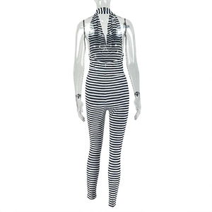 Back view of backless halter stripe jumpsuit with bodycon fit and draped neckline details