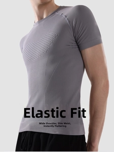 Detail of grey compression shirt showing breathable diamond mesh and ergonomic texture