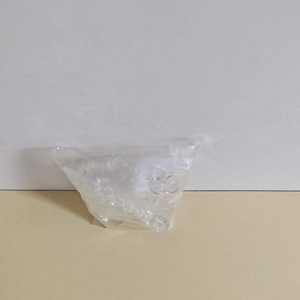 Detailed view of 5-piece transparent acrylic Christmas snowflake and icicle ornaments in pack
