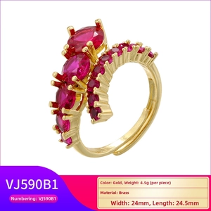 Adjustable gold plated brass ring with oval red gemstones and pave settings