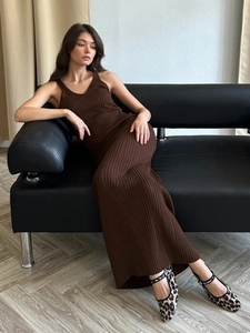 Slim fit dark coffee knit maxi dress with V-neck sleeveless cut on leather sofa