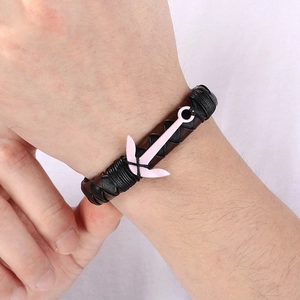 Men's anchor bracelet with pink metal charm and woven black and brown leather cord