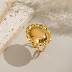 Vintage 18K gold plated oval mirror ring with braided border on travertine stone