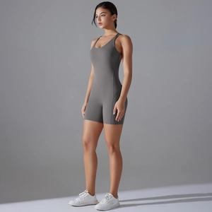Detail view of the seamless grey yoga bodysuit featuring thin straps and body-sculpting fit