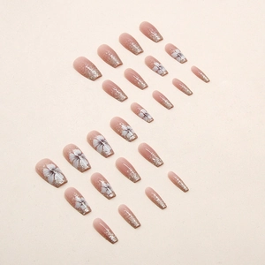 Coffin shaped nude pink gradient press-on nails with silver glitter and white flower art