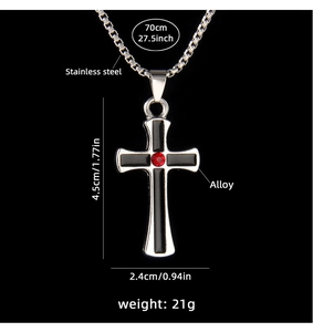 Detail shot of cross pendant with red gem and dimensions 4.5cm on stainless steel chain