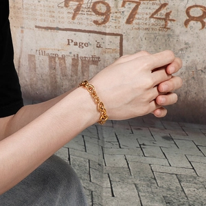 Men's gold titanium steel dragon scale chain bracelet worn on model's wrist