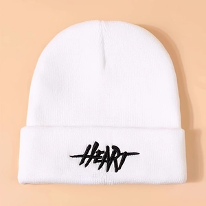 White knitted beanie featuring black HEART embroidery on a minimalist folded cuff