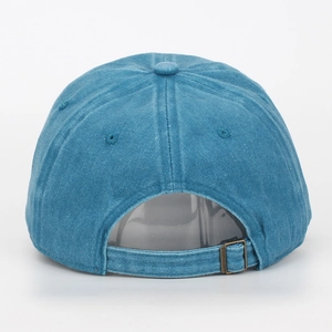 Back view of washed blue cotton baseball cap with adjustable antique brass metal buckle