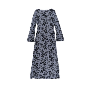 Detailed view of long sleeve floral dress with black leaf print on light blue fabric