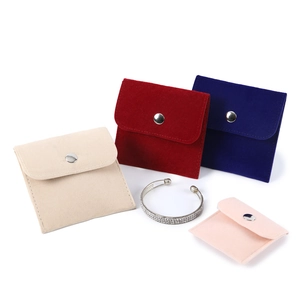 Soft velvet jewelry pouches with snap buttons in assorted colors for storage