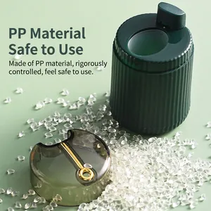 Modern emerald green push-type toothpick holder made of PP material with gold ring handle
