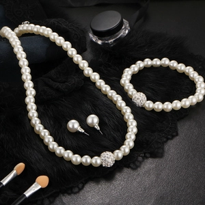 Elegant white faux pearl jewelry set with sparkling rhinestones for bridal weddings