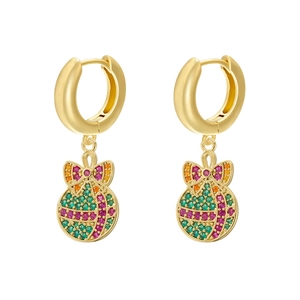 Close-up of golden Christmas ball hoop earrings with colorful pavé gemstones and bows