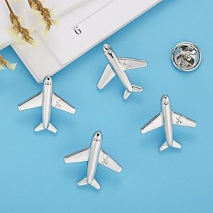 Set of four silver airplane lapel pins with polished metal finish and butterfly clasp