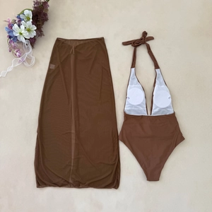 Flat lay of brown halter neck one-piece swimsuit and matching mesh sarong with floral decor