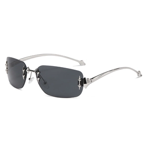 Fashionable rimless Y2K sunglasses with silver metal star decor and gray gradient lenses