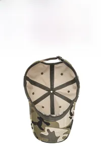Detail of camouflage baseball cap interior featuring breathable fabric and adjustable strap