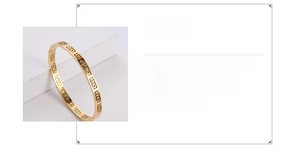 Detail view of gold 316 stainless steel bangle with Greek key pattern and product specs