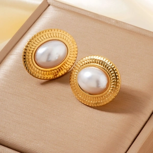 Retro gold-plated pearl stud earrings with sunburst texture on champagne silk