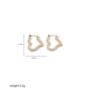 Detailed view of gold heart earrings with woven texture and size markings 2.3cm