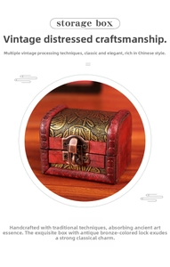 Macro shot of vintage red jewelry box featuring a gold floral pattern and brass clasp