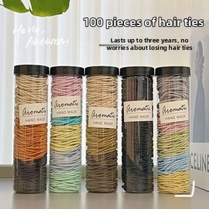 Cinco tarros cilíndricos con juegos de 100 gomas para el pelo de alta elasticidad