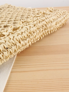 Handwoven straw tote bag with white lining for summer beach vacations and casual use