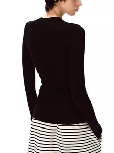 Slim fit black wool tencel long sleeve top for women shown from the back view