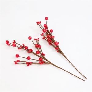 Detailed view of artificial red berry branches for holiday and home floral decoration