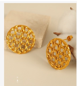 Macro detail of gold plated steel stud earring with hollow chain mesh design and pin