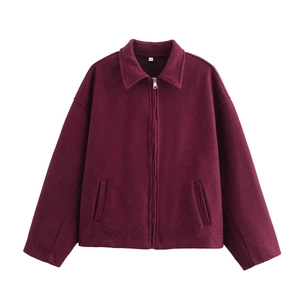 Detailed close-up of wine red wool jacket featuring collar and metal zipper closure
