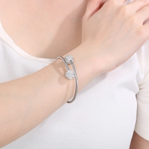 Silver flexible cable wire cuff bracelet with sparkling crystal pave spherical charms