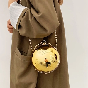 Chic gold spherical acrylic evening bag with metallic chain strap and mirror finish