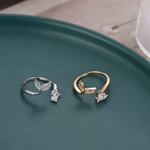 Adjustable mermaid tail open rings in gold and silver finish with micro-set zircon crystals