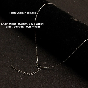 Close-up of 0.8mm silver bead chain necklace showing dimensions and lobster clasp details