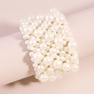 Detail of multi-row elastic pearl wide bracelet featuring varying bead sizes on a stand