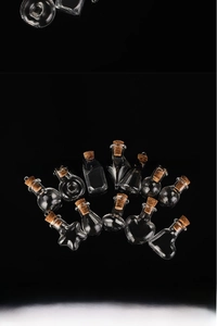 Detailed view of mini assorted glass drifting bottles with cork stoppers for DIY crafts