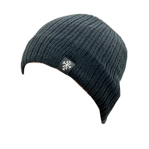 Detail of black ribbed knit beanie with white snowflake patch for winter warmth