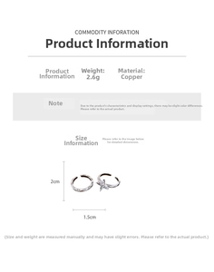 Detail view of silver copper rings with BE HAPPY engraving and zircon star accent