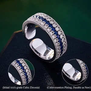 Adjustable silver compass ring featuring triple-row pave set blue and white zircon stones