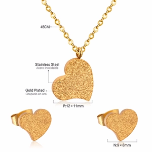 Macro view of gold stainless steel heart necklace and studs with 45cm length details