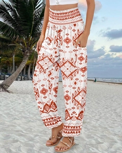 Detail of high waisted bohemian print harem pants with pockets and elastic waist