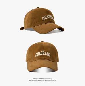 Close-up of brown cotton baseball cap featuring white Colorado embroidery detail