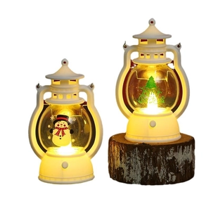LED Christmas lantern ornaments with snowman and Merry Christmas tree design in warm light