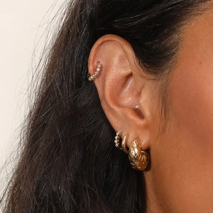Detailed close-up of S925 silver gold-plated ear cuff set with micro-pave cubic zirconia