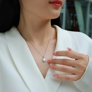 Elegant S925 sterling silver necklace featuring a 2-carat Moissanite halo pendant on a model
