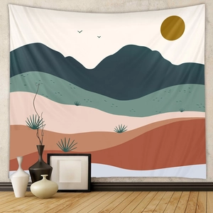 Detail of bohemian tapestry featuring abstract mountain landscape and yellow sun design