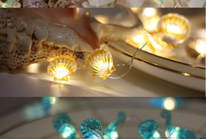 Detail of LED ocean string lights featuring warm shell and cool blue seahorse shapes